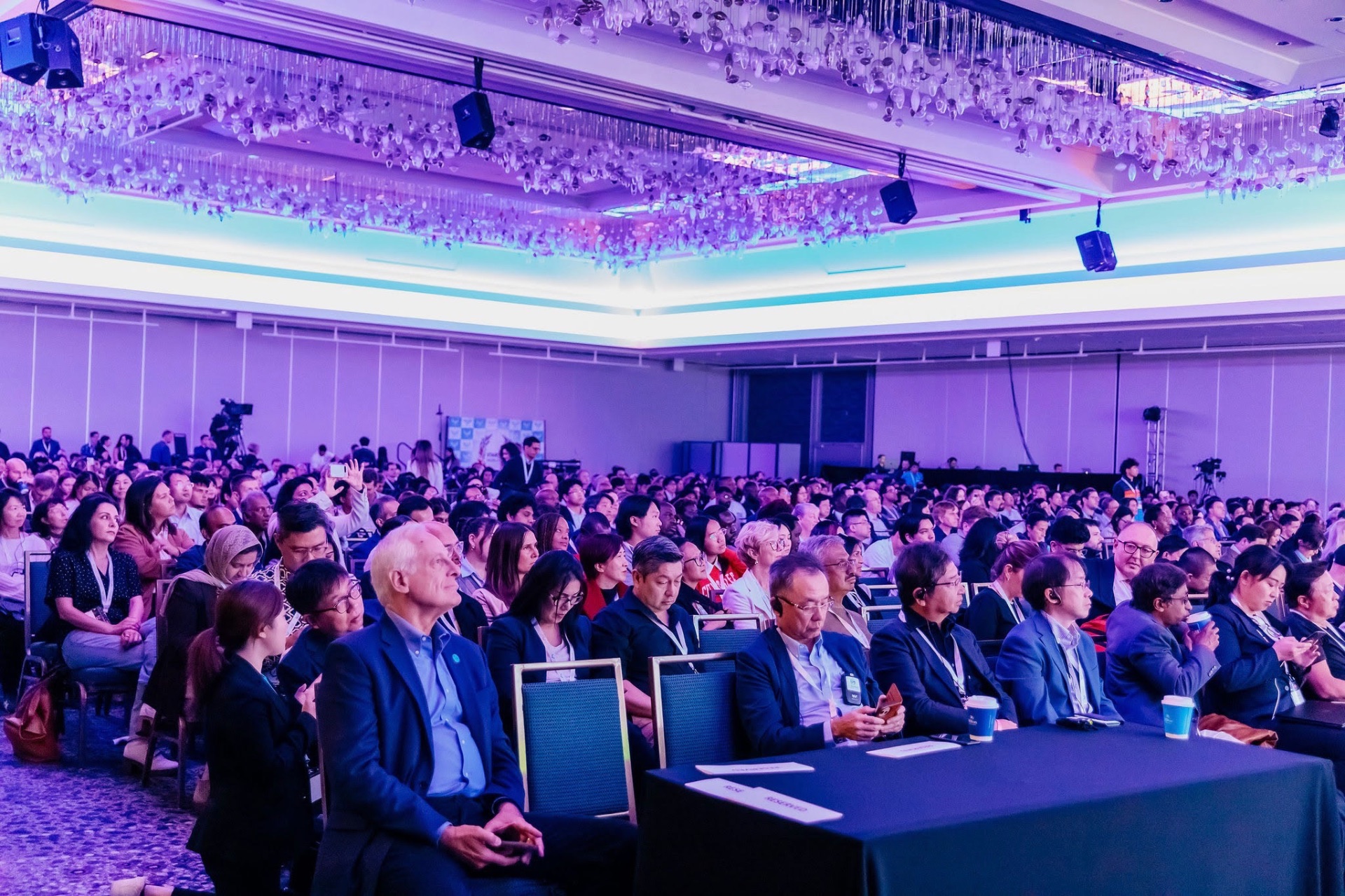 A packed ballroom audience